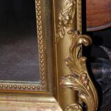 Miroir doré à fronton coquille de style Louis XV fin XIXème