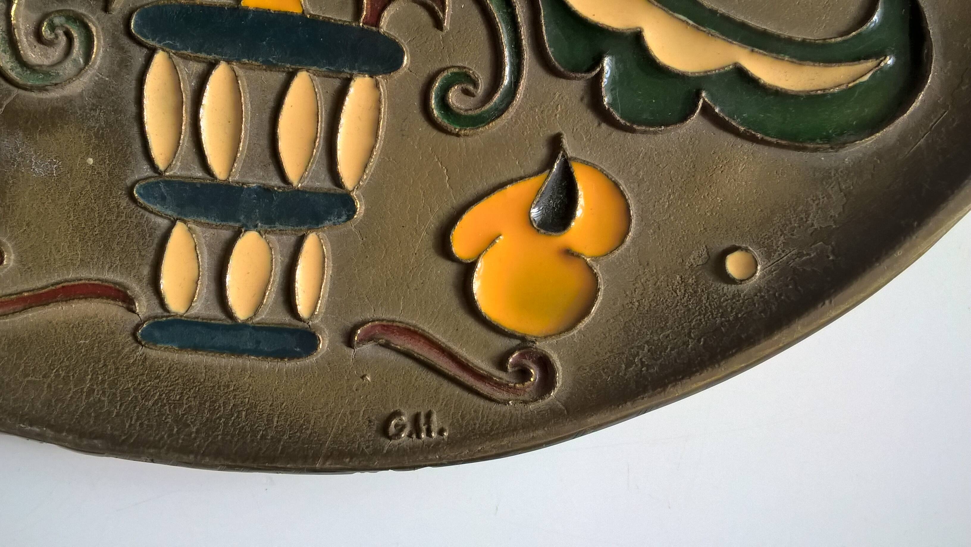 Old decorative brass and enamel wall plate signed GH