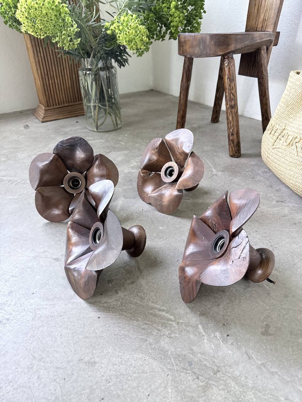 Four wooden flower wall lights from the 1970s.