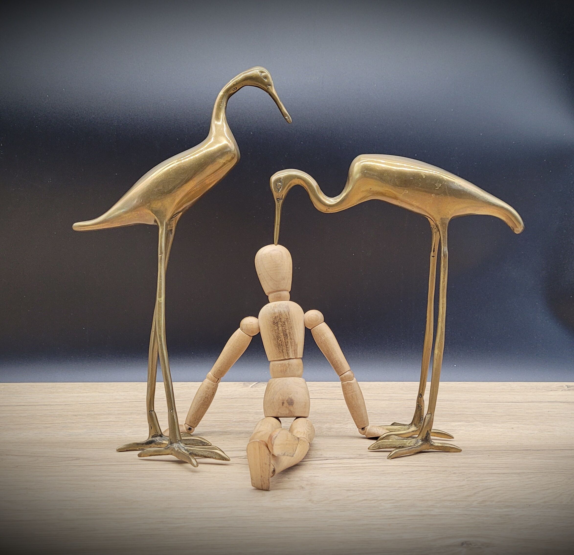 Duo brass herons