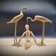 Duo brass herons