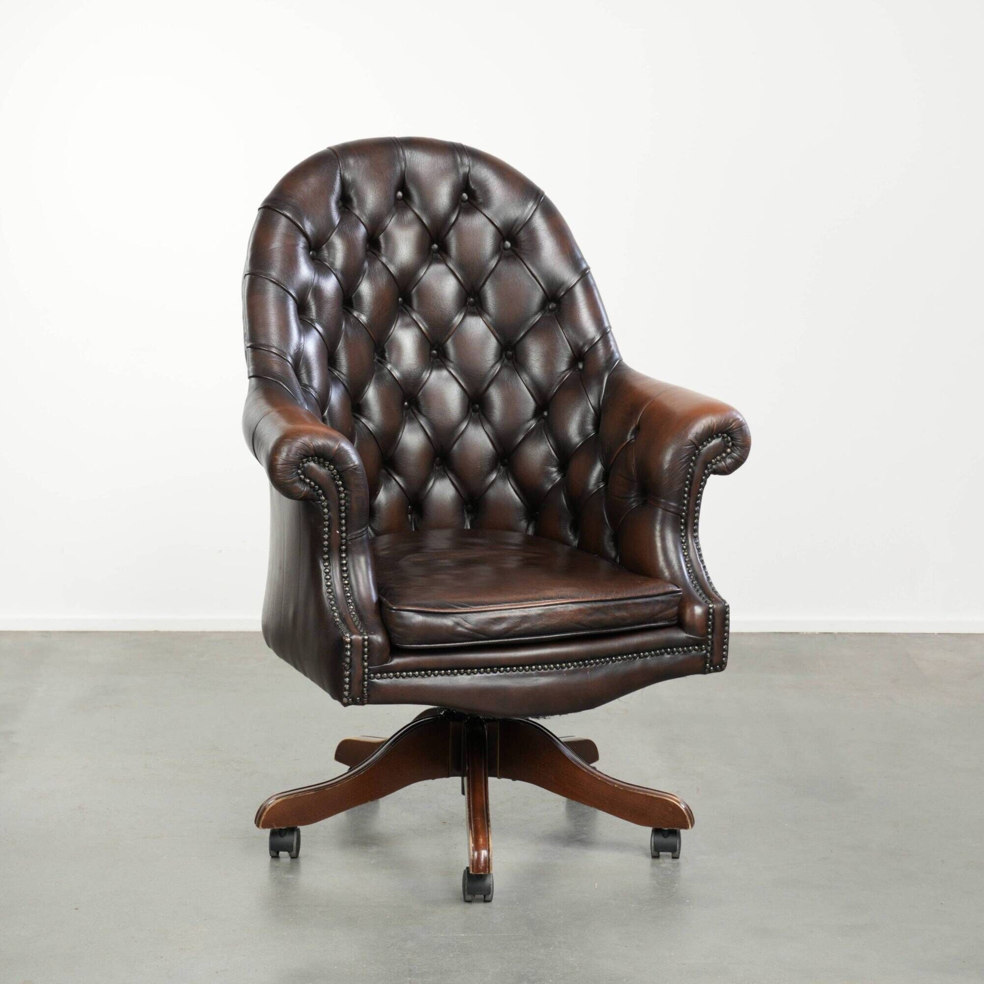 Brown cow leather Chesterfield office chair on wheels in English style