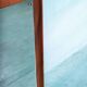 Minimalist Scandinavian mirror in teak with a vintage design.