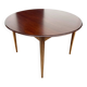 Danish round dining table in rosewood – 1950s design with butterfly extension.