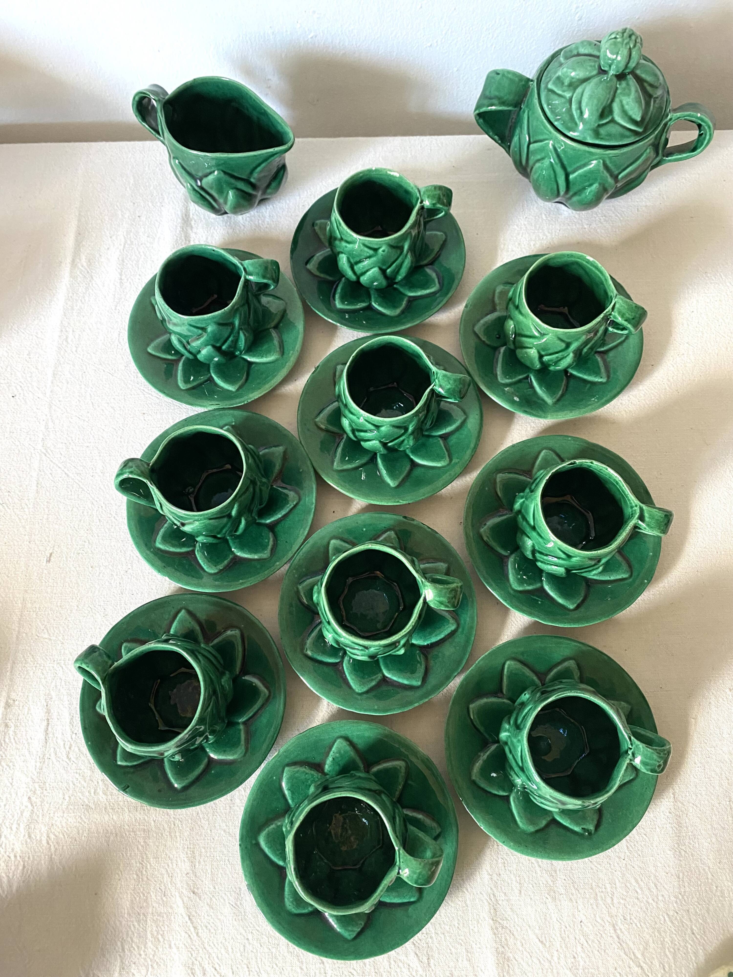 Antique slip cups with saucers, sugar bowl and milk pitcher