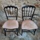Pair of antique Napoleon III chairs in blackened wood and fabric.