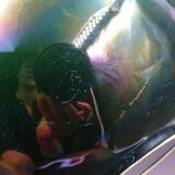 Green faience bowl decorated with multicolored drips around 1970