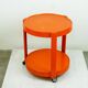 Orange circular plastic cart in Italian Space Age style