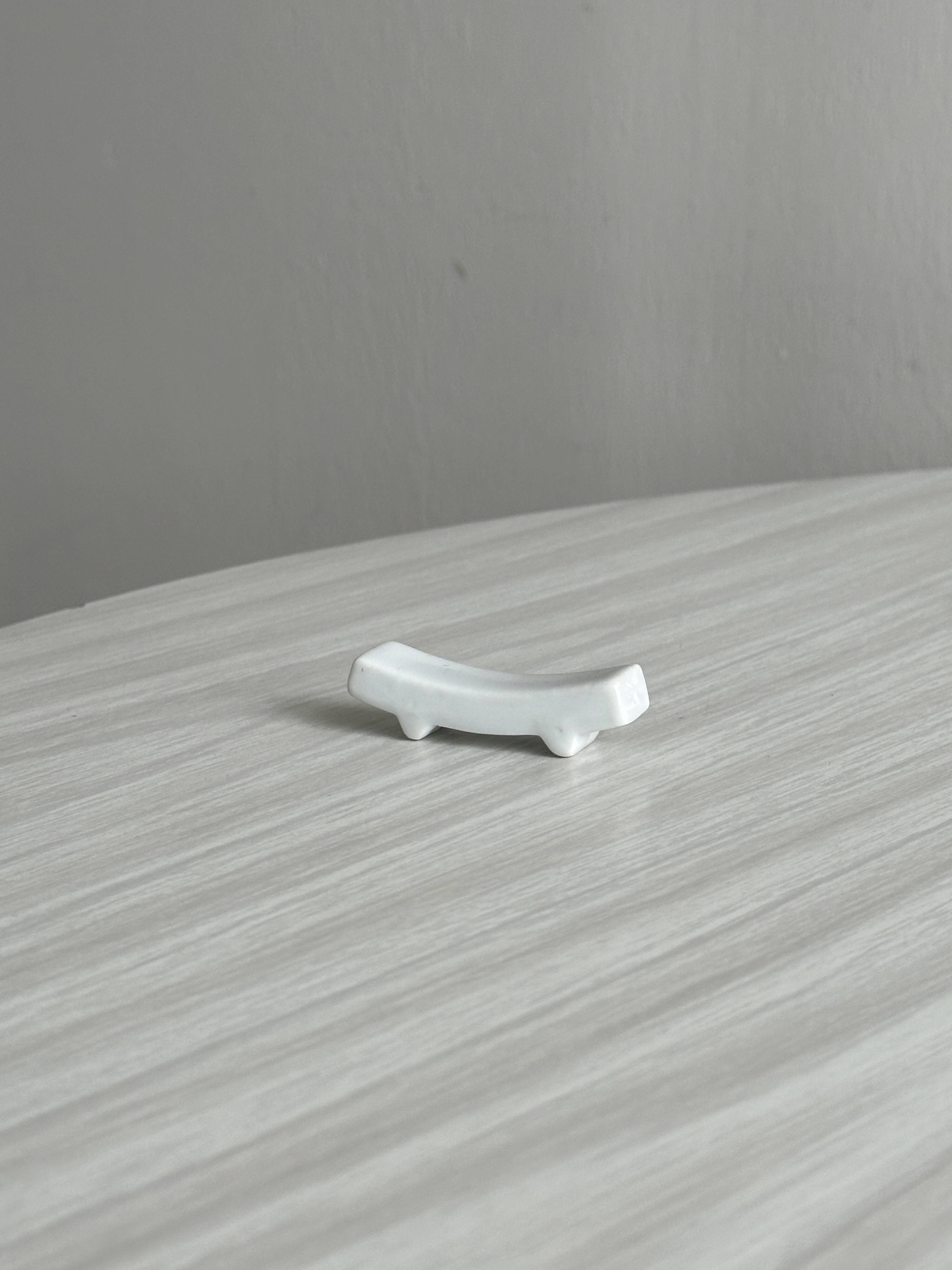Set of white porcelain chopstick holders