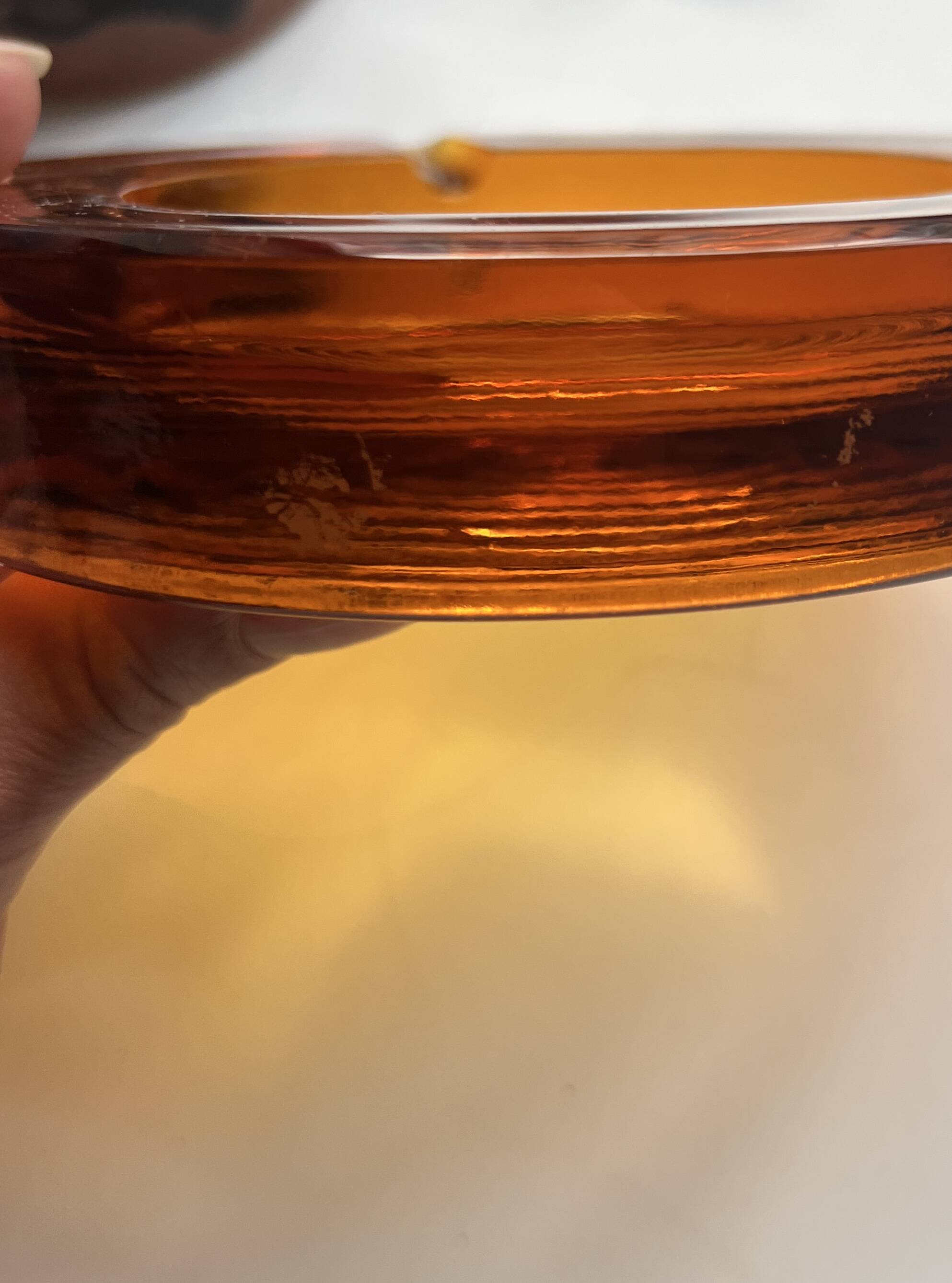 Amber pressed glass ashtray, 1970s design.