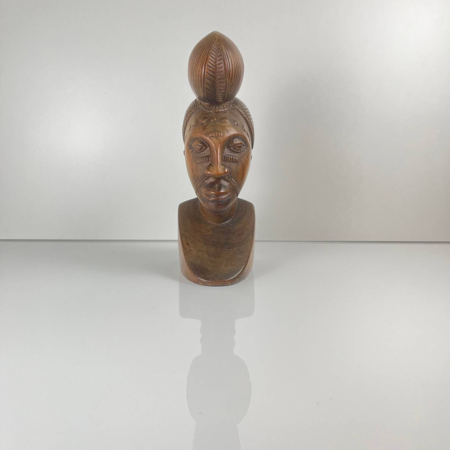 Hand-carved female bust in black wood, Baoulé style, 1960/90