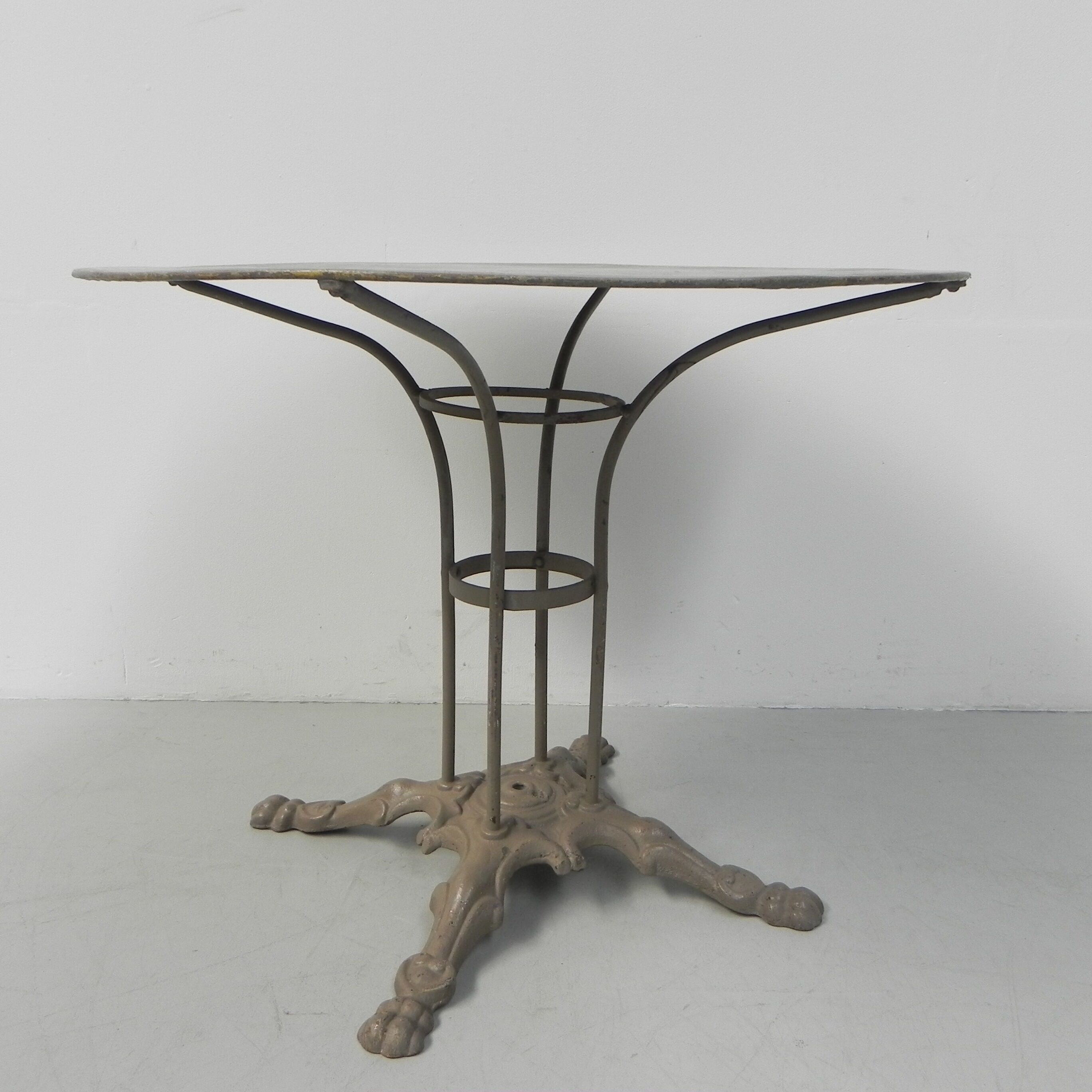 Steel garden table on cast iron base