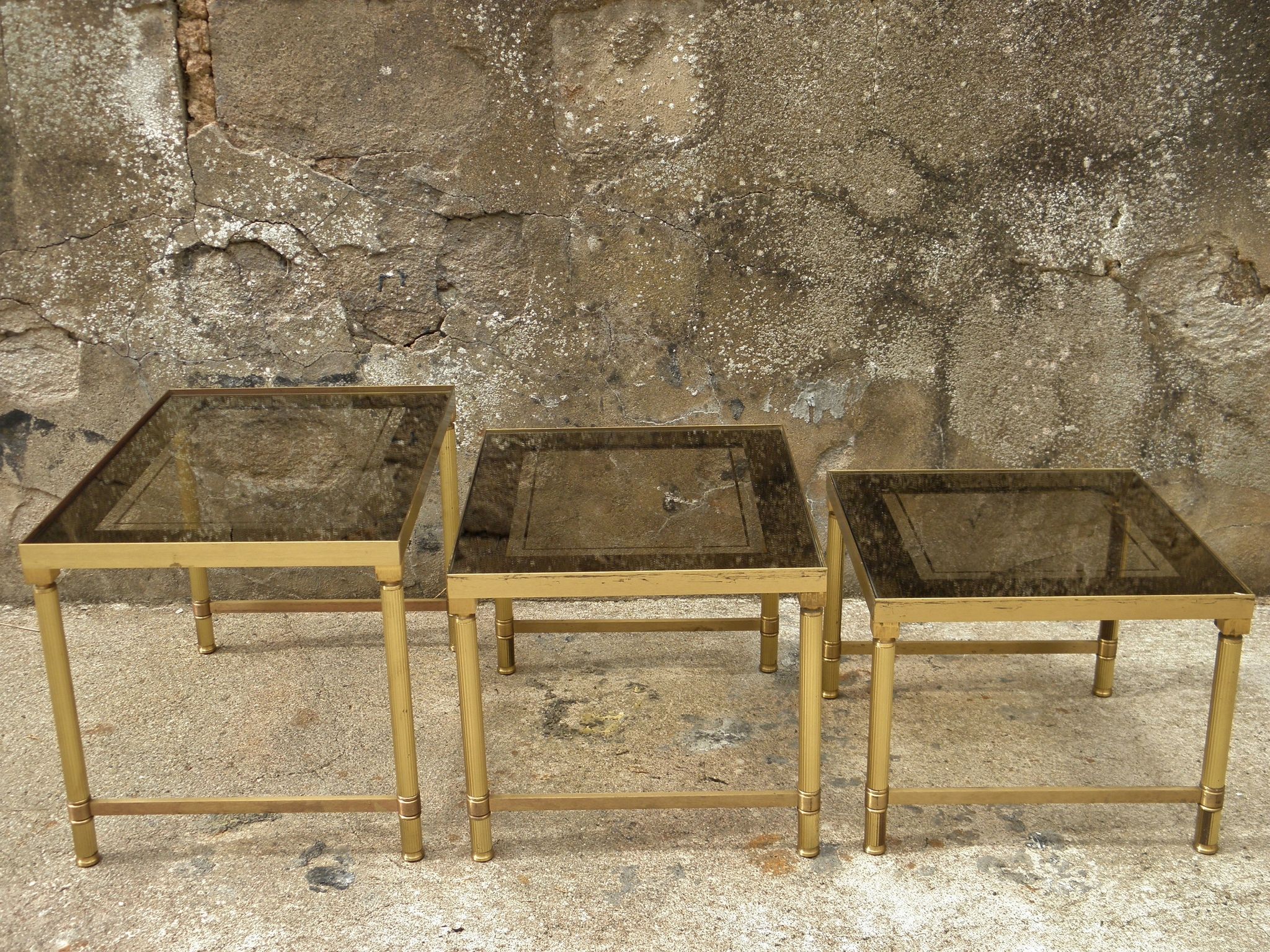 Brass, gold metal and 70s mirror glass tables
