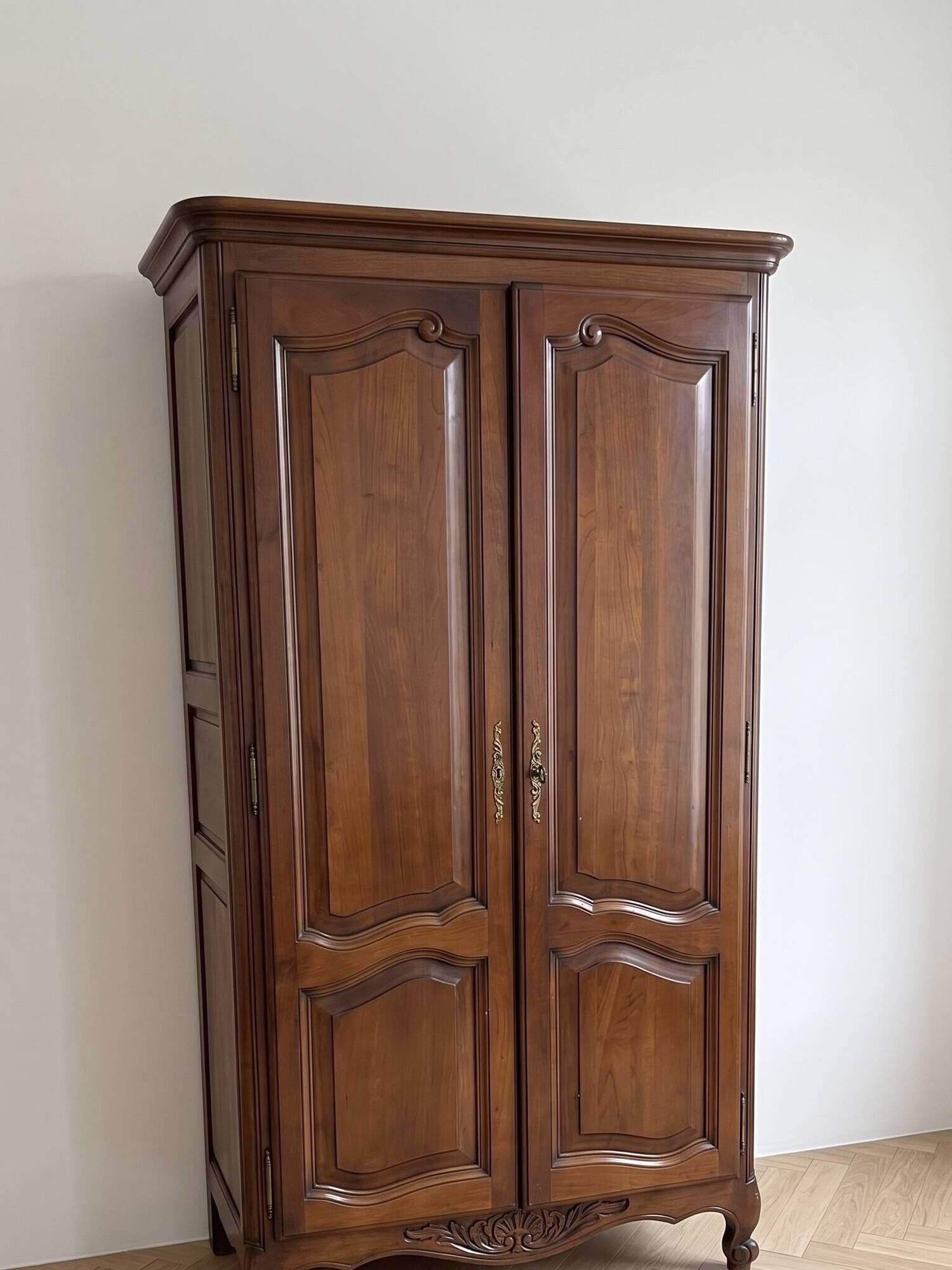 Antique wooden wardrobe in vintage style