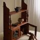 Primitive wall shelf in pine, by a Swedish upholsterer, late 19th century.