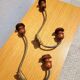 Pair of antique wooden and metal coat hooks