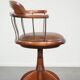Swivel side chair / office chair with a cognac-coloured cow leather seat