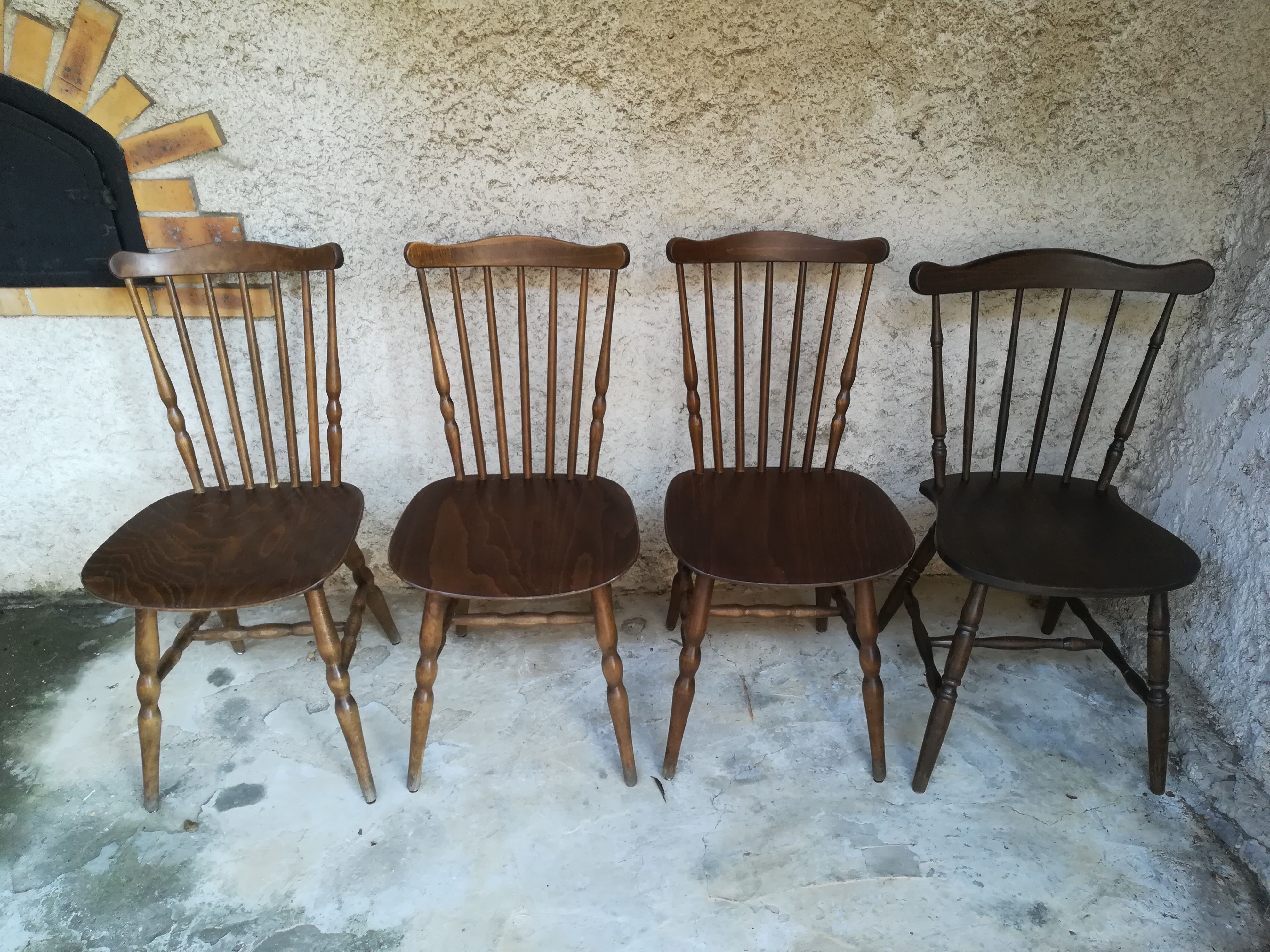 Eight mismatched bistro chairs