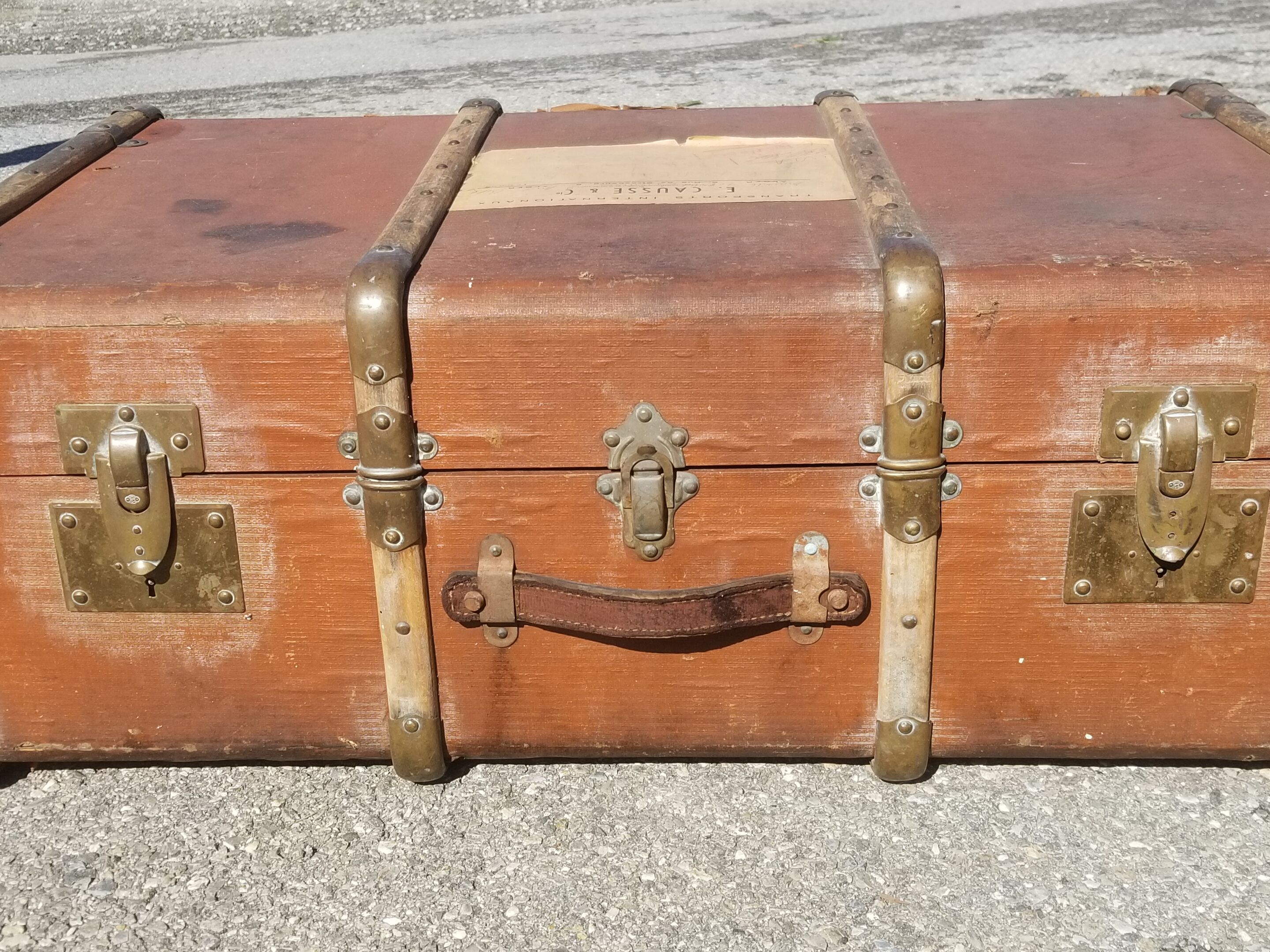 Old travel trunk made of wood and brass