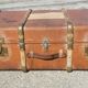 Old travel trunk made of wood and brass