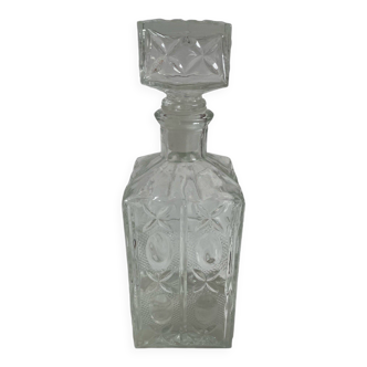 Molded glass carafe, 1960s-1970s, stylized flower decoration, oval, square base, stopper, rosette