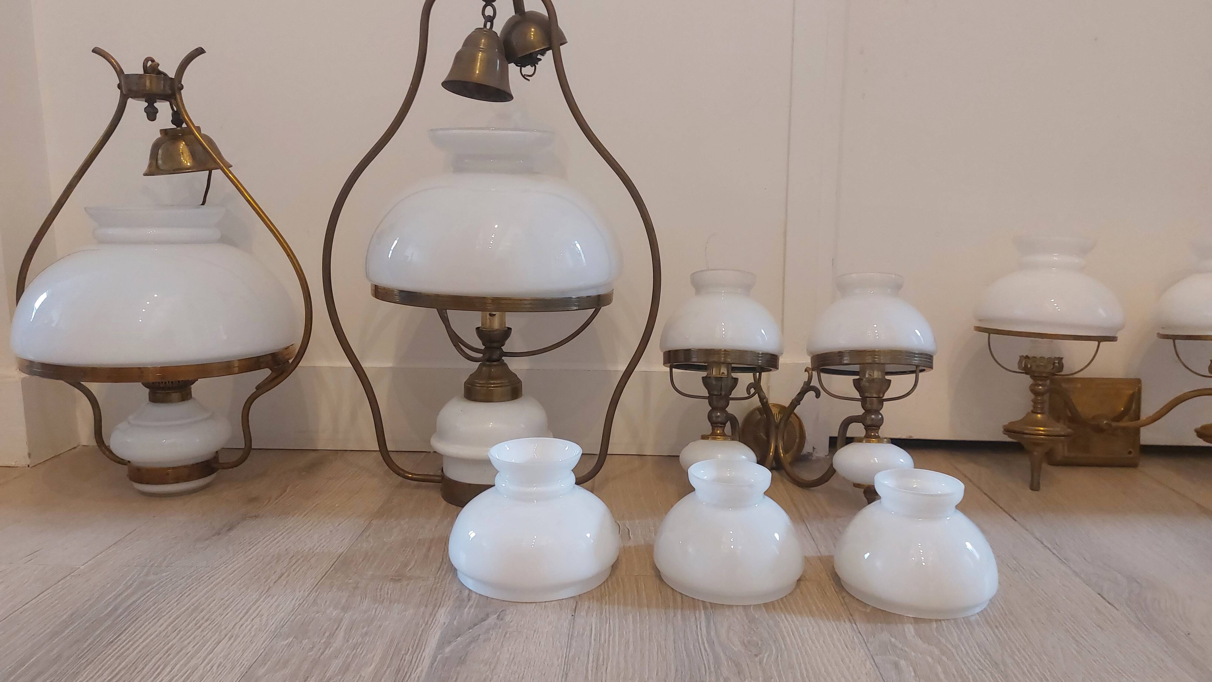Lots of 1950s copper/ brass suspensions and wall lights with shades.