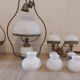 Lots of 1950s copper/ brass suspensions and wall lights with shades.