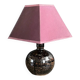 Ceramic floor lamp with a pyramidal shade and square base.