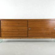 Teak sideboard with glass legs, France - 1990s
