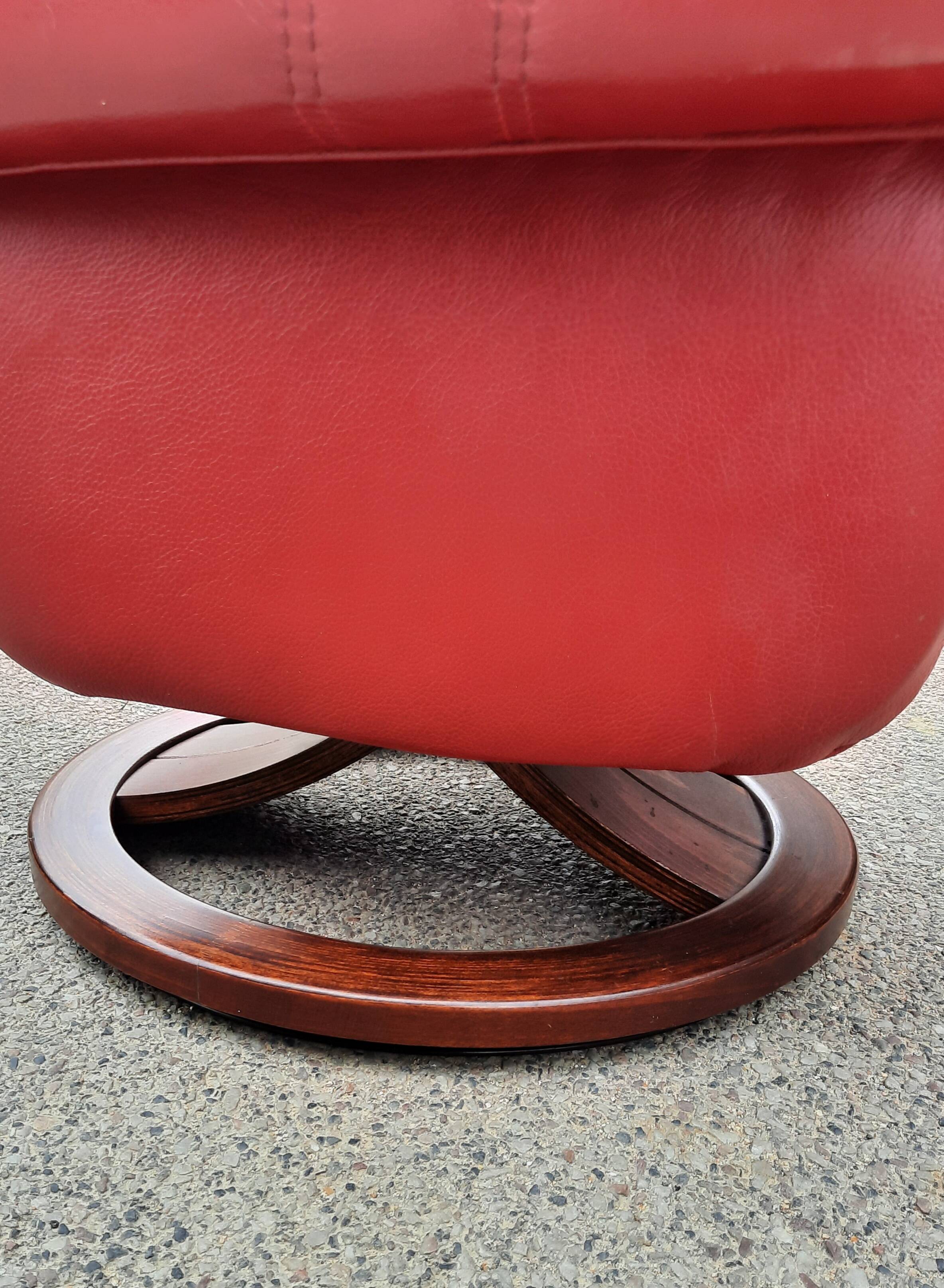 Red leather relax armchair and pouf