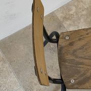 Vintage children's school chair in wood and black metal, industrial style.