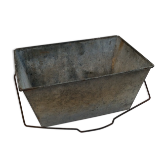 Ancient zinc basin pierced in base
