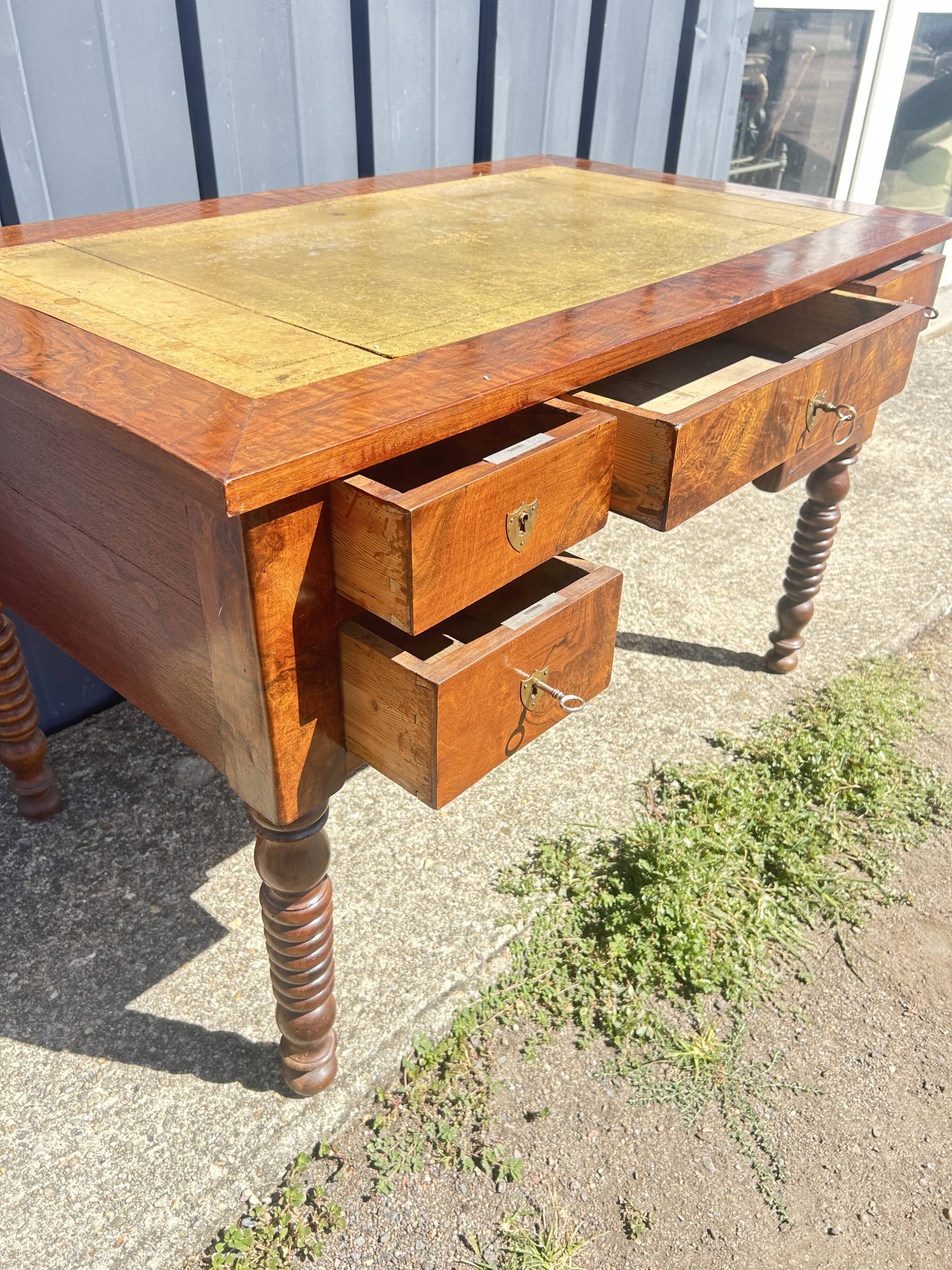 Louis Philippe desk in walnut, with a leather top.
