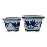 Duo of decorative plant pots with blue irises.