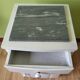 White night table with grey marble top