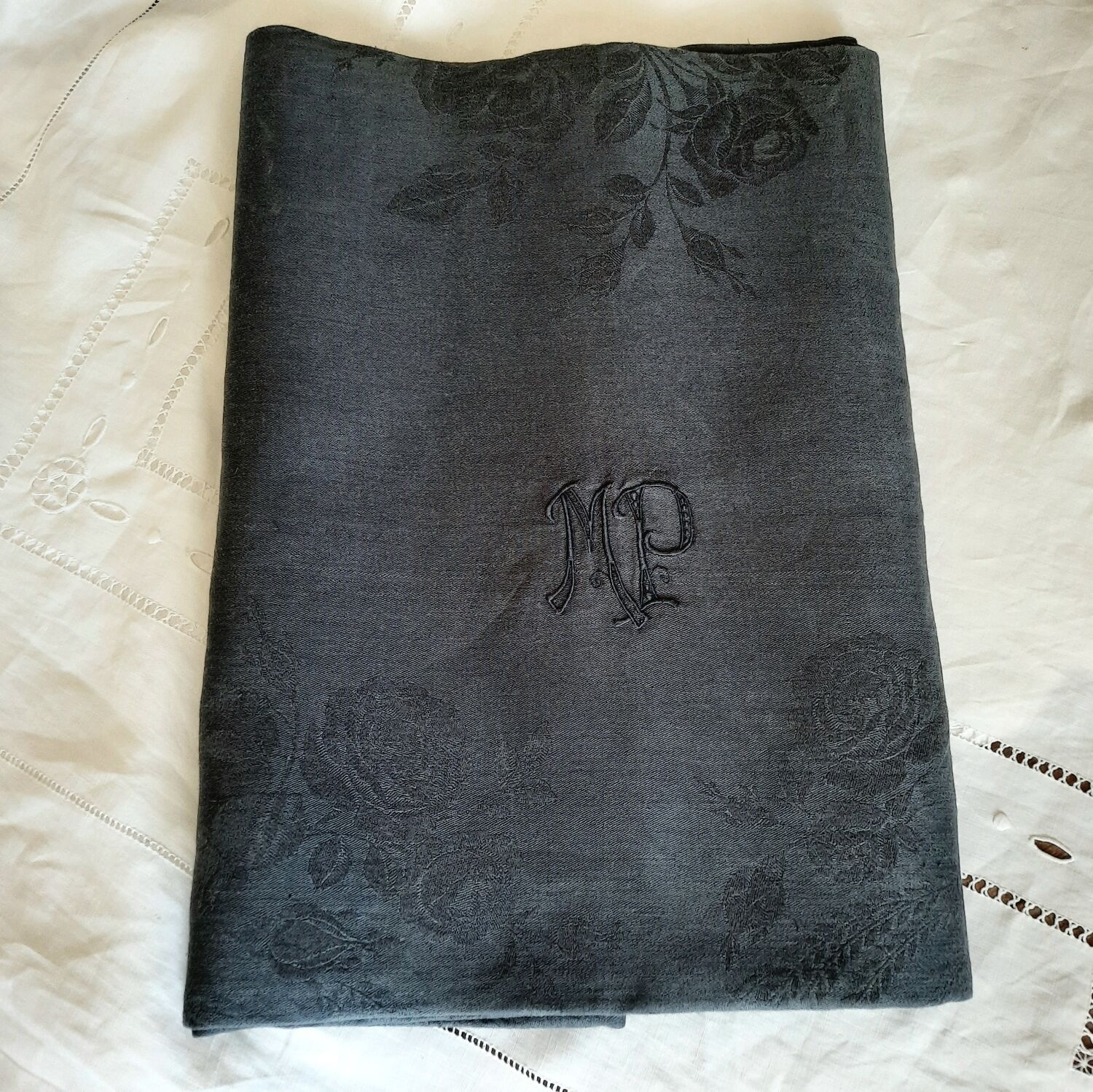 Old damask tablecloth with monogram