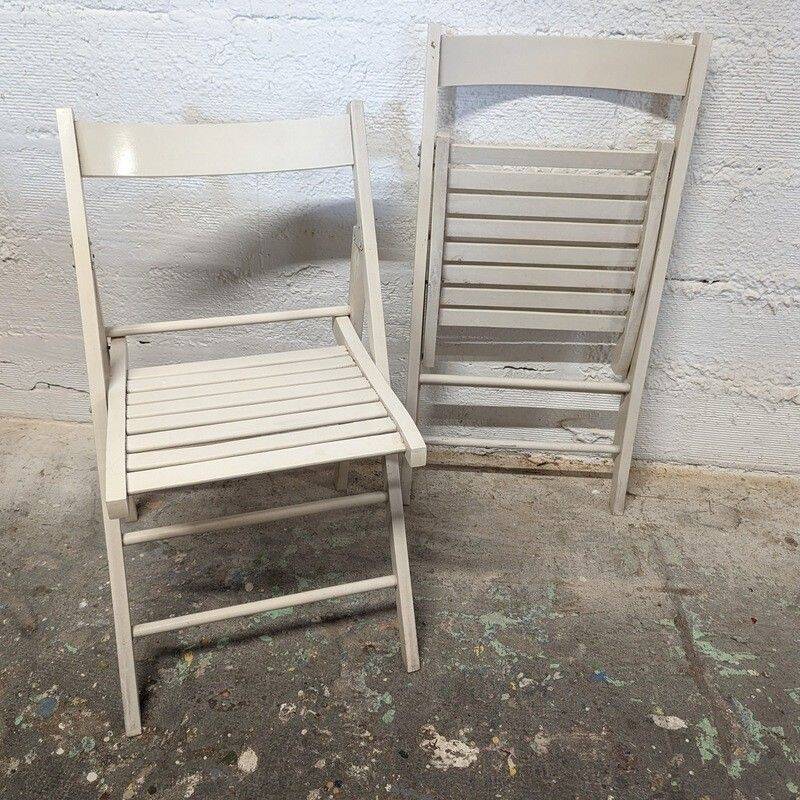 Pair of white wooden folding chairs