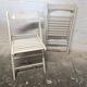 Pair of white wooden folding chairs