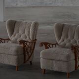 Pair of modern Swedish lounge chairs, shearling sheepskin and elm, 1940s.