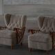 Pair of modern Swedish lounge chairs, shearling sheepskin and elm, 1940s.
