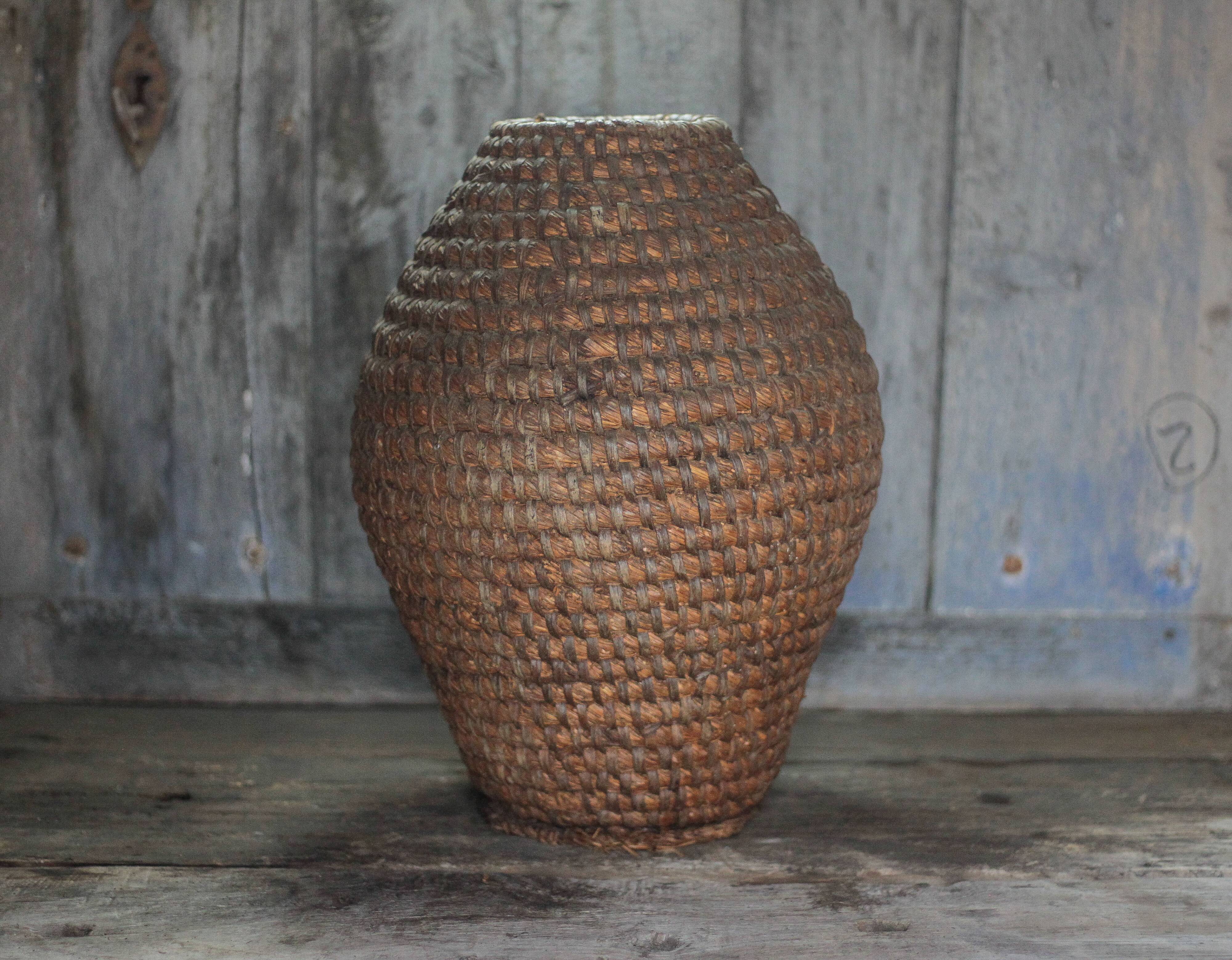 Old basket, straw and bramble bourgne, woven basket, interior decoration.
