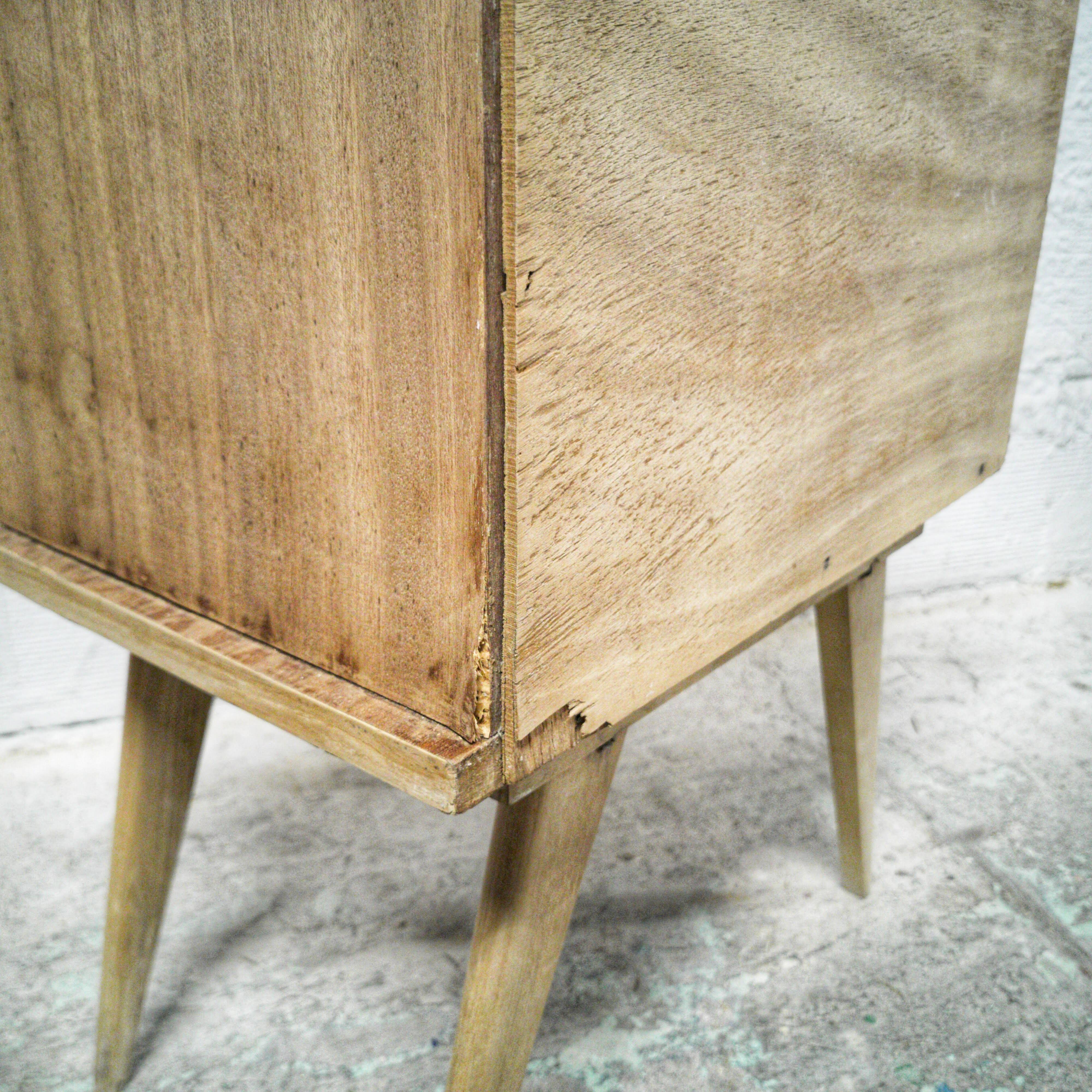 Vintage bedside table with compass legs