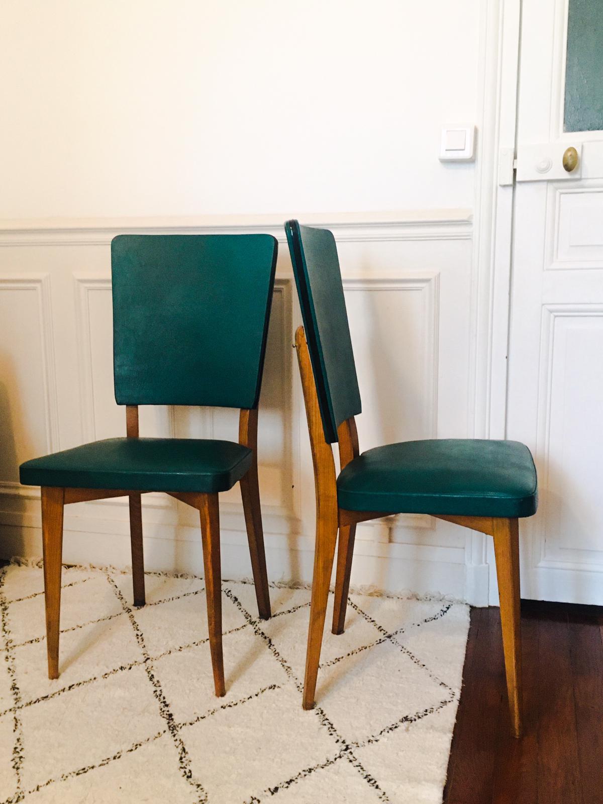 Two 1950s chairs made of wood and skai