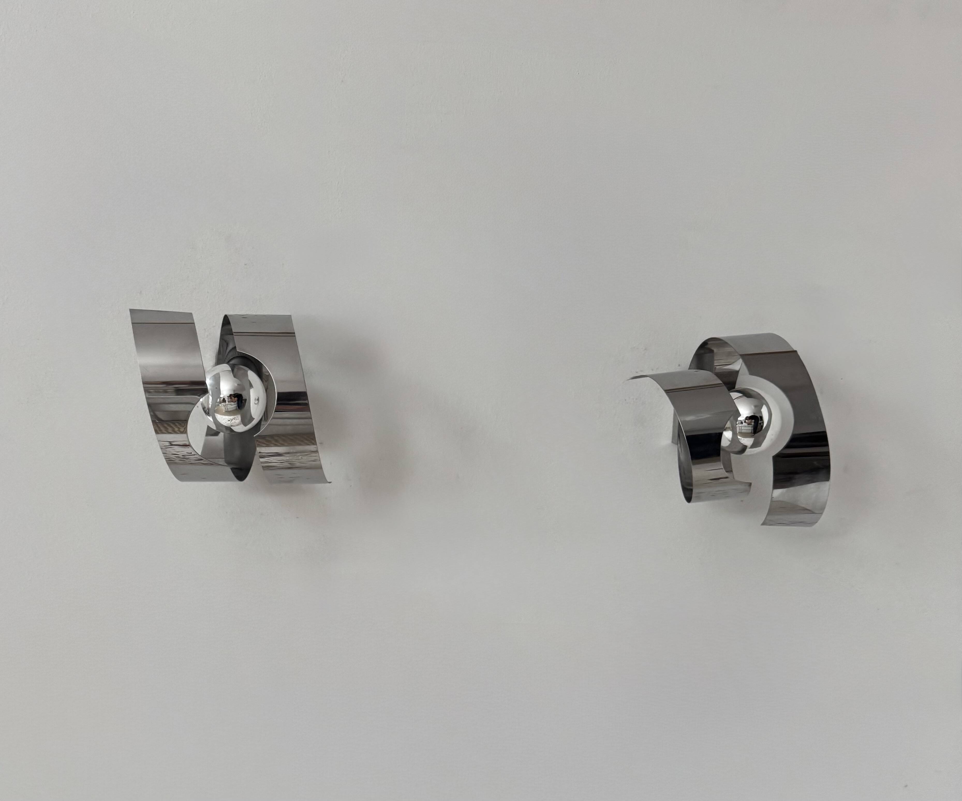 Pair of vintage wall sconces, curved chrome-plated metal, France, 1970