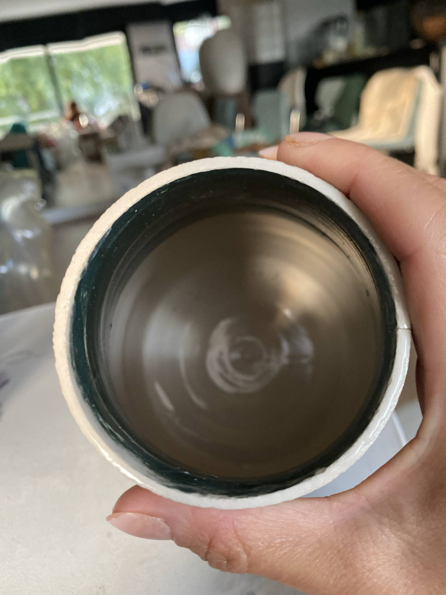 New green ceramic artisanal vase.