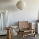 Reclining armchair in natural wood and woven rattan