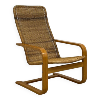 Scandinavian armchair in woven rattan
