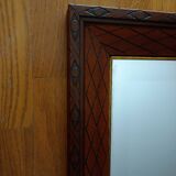 Beveled mirror, carved wood, gilded outline. 58x78x3 cm