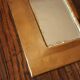 Rounded brass mirror