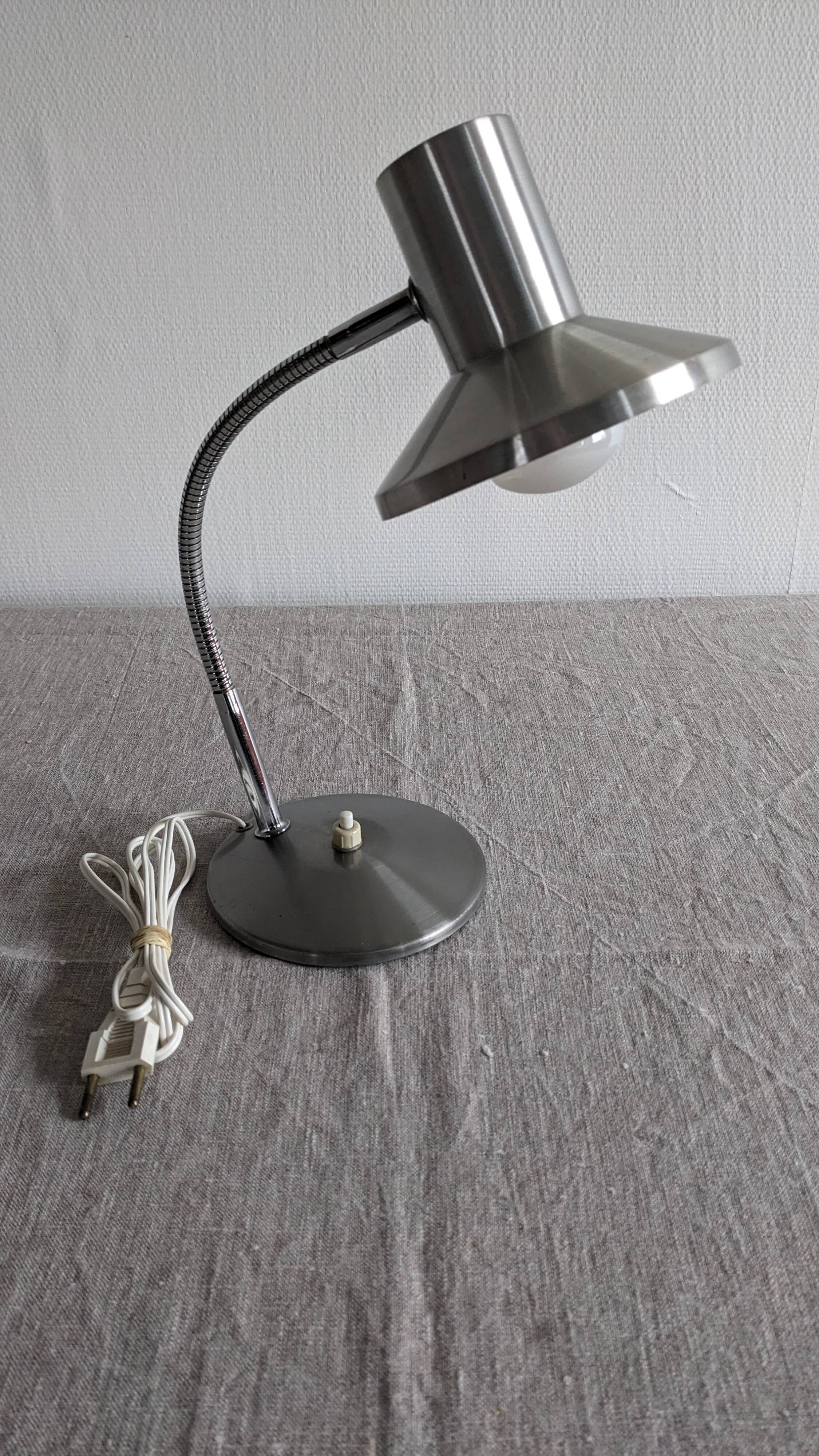 Articulated bedside lamp or wall light in aluminium, France circa 1960.